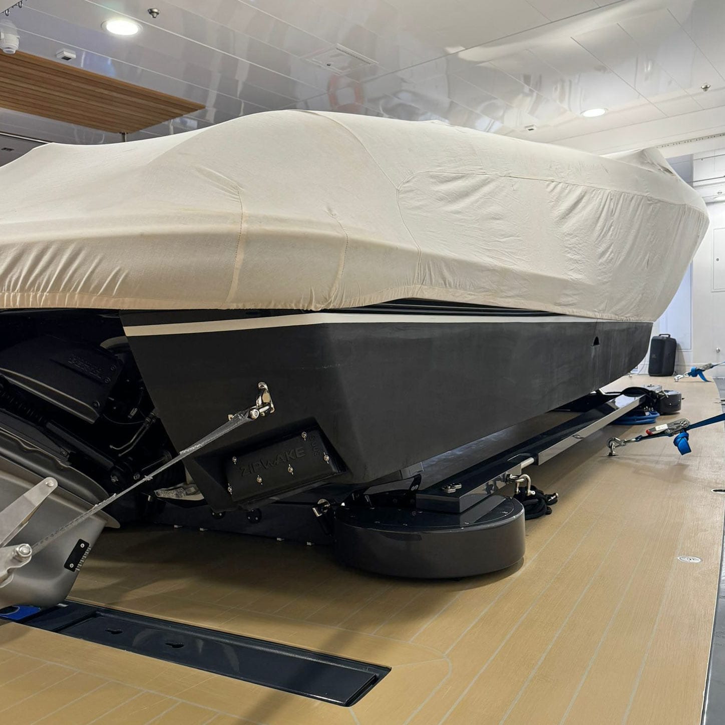 Tender garage hover chocks strapped down